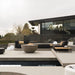The Arya Outdoor Modular Sectional Sofa In Arcadia Color Behind a House