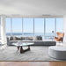 The Arya Modular Sectional in Porpoise Fabric and Color in a Living Room Next to Window