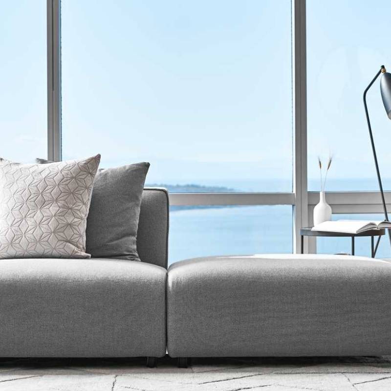 Close Up View of The Arya Modular Sectional in a Living Room Against a Window
