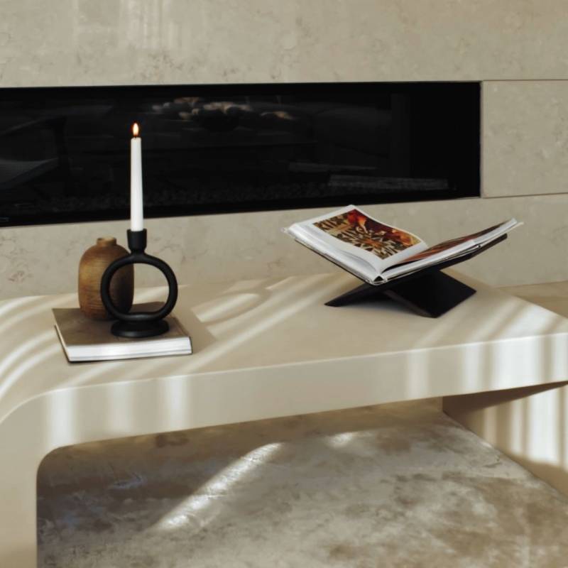 Front View of The Cascadia Coffee Table With Alabaster Concrete Surface in a Living Room with Decorative Book on Top