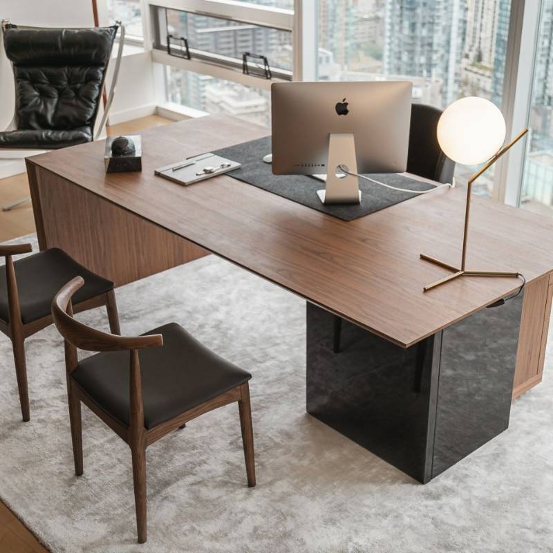 Two Elbow Chair in Trento Jet Black and Wood Finishes used as Guest Chairs in an Office