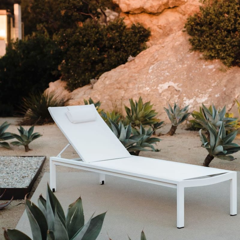 Angled View Of White Spencer Outdoor Lounger In The Backyard