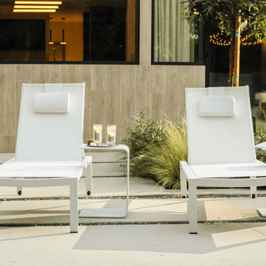 Two White Spencer Outdoor Loungers In The Backyard