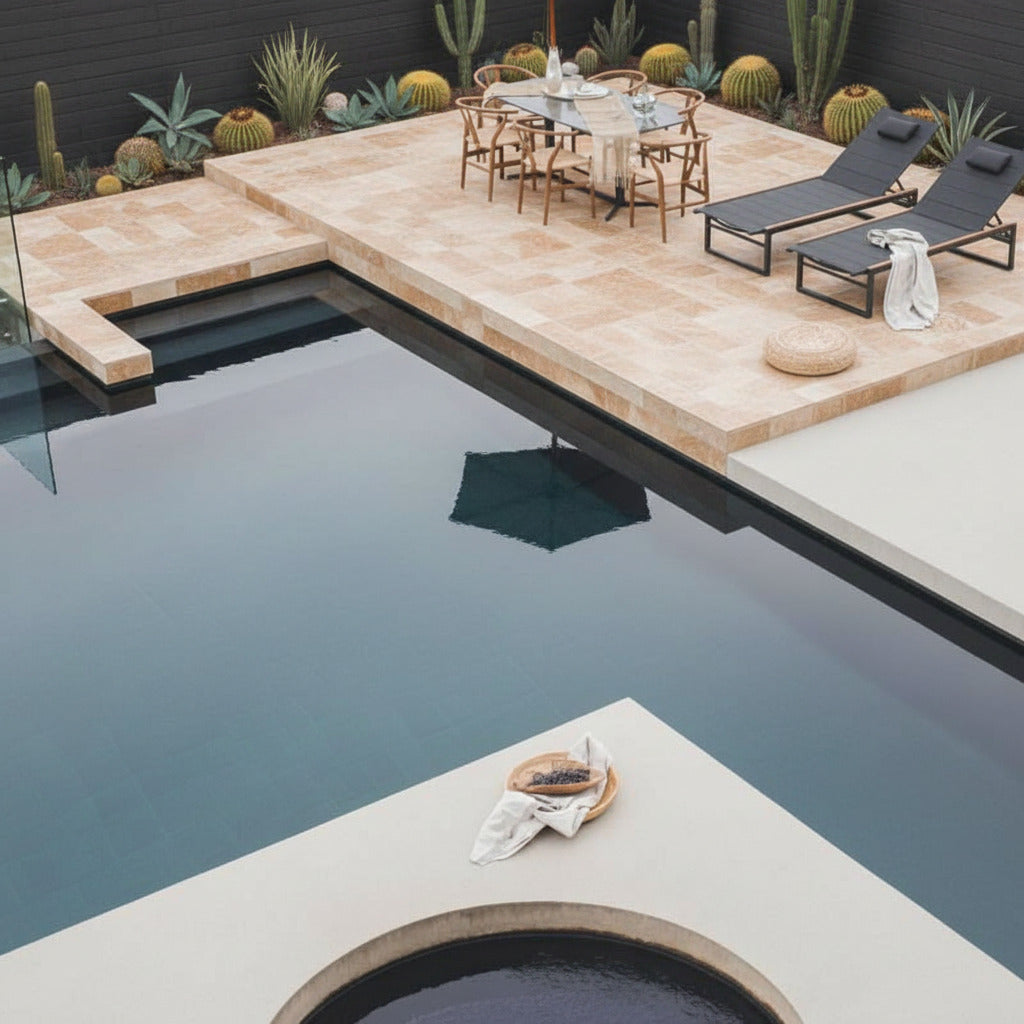 Elaine Dining Table With Black Pietra Ceramic Surface and Black Base on a Deck Next to a Pool