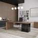 Angled View of The Gia Desk With Walnut Veneer Finish and Black Pietra Ceramic Base in an Office