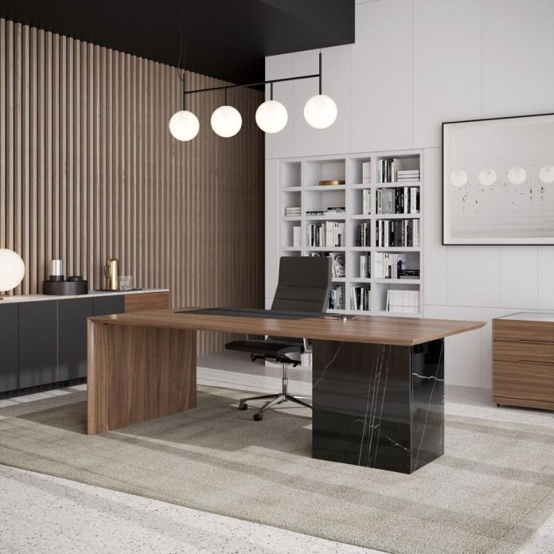 Angled View of The Gia Desk With Walnut Veneer Finish and Black Pietra Ceramic Base in an Office