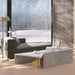 The Porter Right Arm Chaise in the Corner of a Living Room Next to a Window
