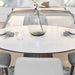 Close Up View of The Winston Dining Table 48 Inch With High Gloss White Lacquer Surface and Walnut Veneer Finish With Place Settings