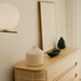 Angled Side View of The Wishbone Dresser in a Bedroom